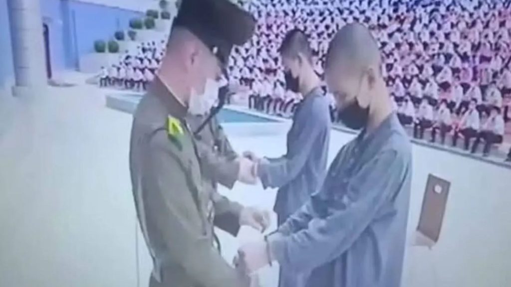 Hell of Kim Jong-un’s regime exposed as vid shows teens sent to GULAG for watching banned TV in front of stadium crowd