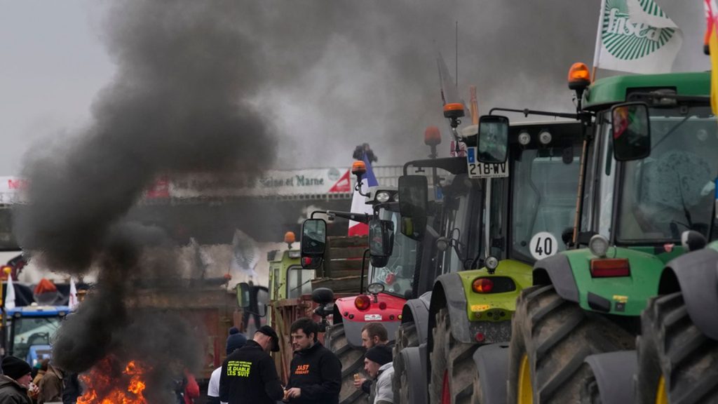 Farmers encircling Paris with their tractors may seem good-natured – but their purpose is serious | World News