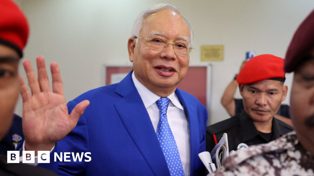 Malaysia halves ex-PM Najib Razak's jail term over 1MDB scandal