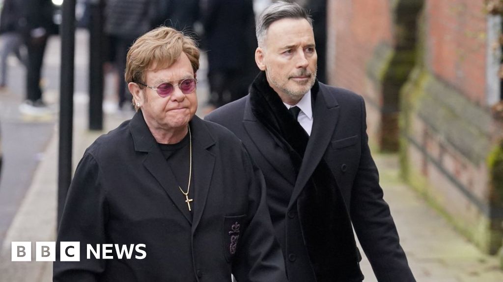 Elton John and Tony Blair attend Draper's funeral
