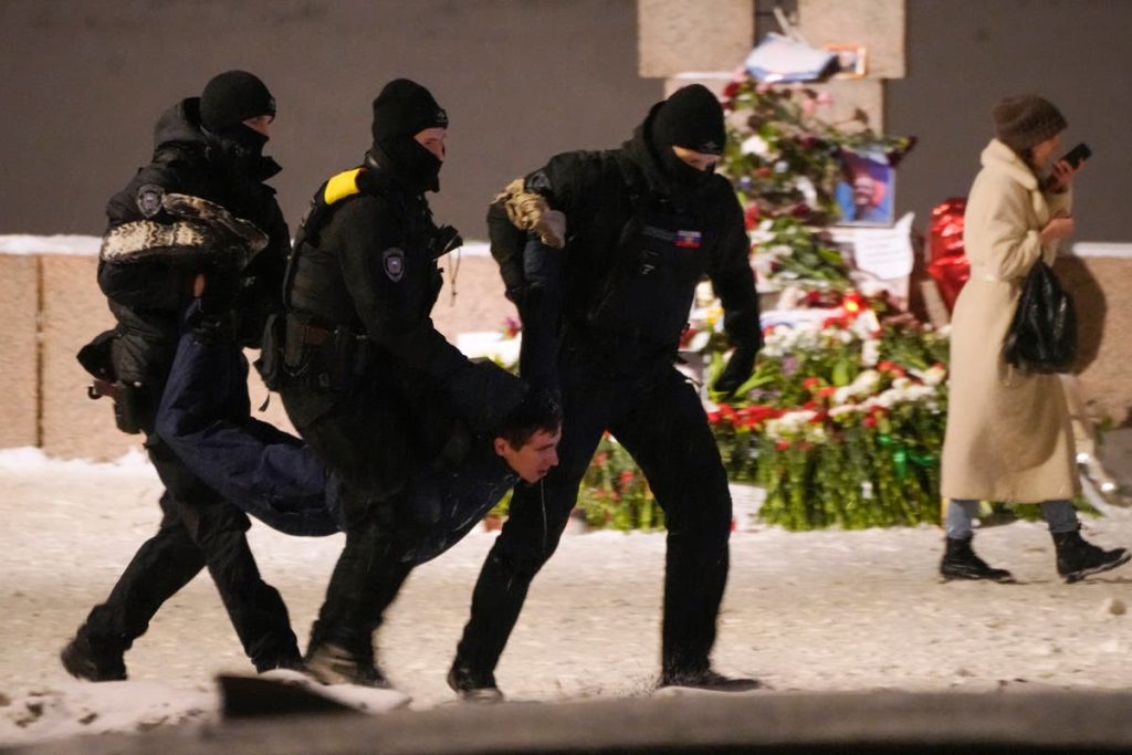 Tributes to Alexei Navalny, Putin’s greatest foe, removed from Russian cities as police look on