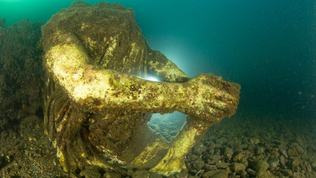 Explore real-life ATLANTIS as stunning diver pics from lost city of Baia reveal ancient mosaics and moss-coated statues