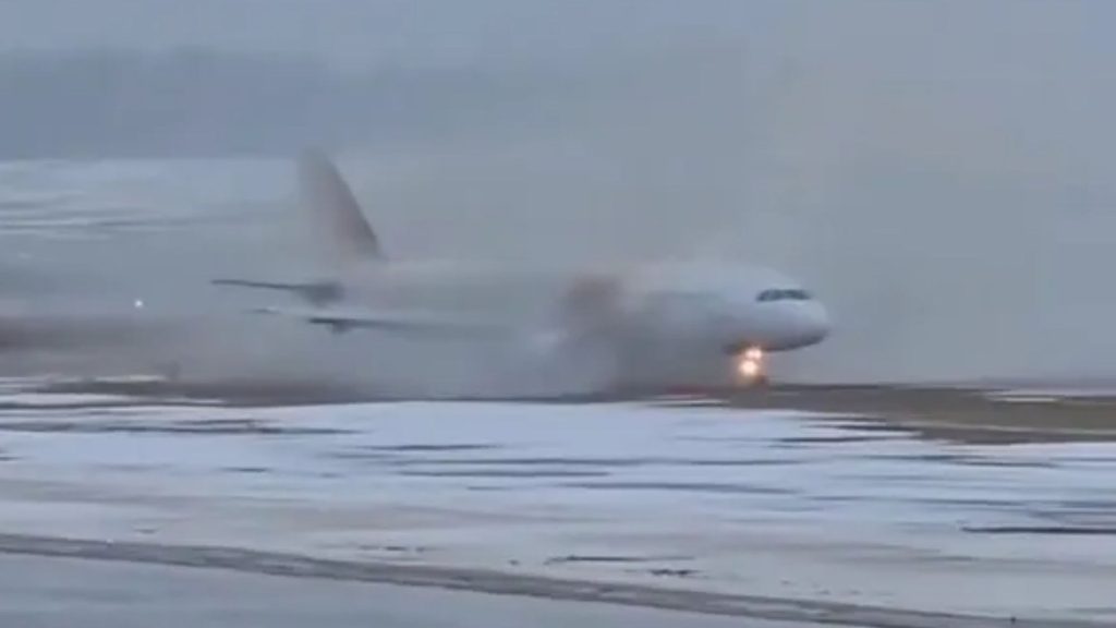 Terrifying moment passenger plane SKIDS off soaking runway and heads straight towards terminal in landing from hell