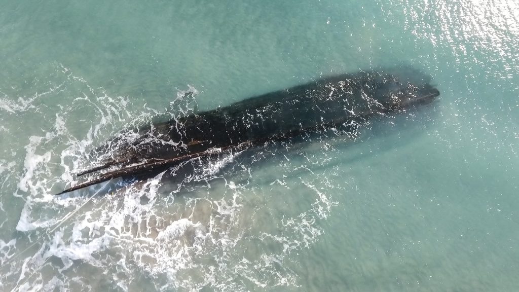 Wild theories behind mystery shipwreck dubbed the ‘Ghost in the Sand’ that washed up on treacherous shore out of nowhere