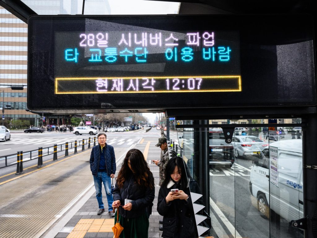 South Korean bus drivers return to work after strike causes rush-hour chaos | transport