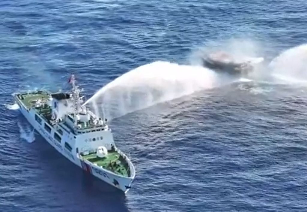Shocking moment Chinese coastguard cave in windows of civilian aid boat with water cannon injuring 4 in WW3 flashpoint