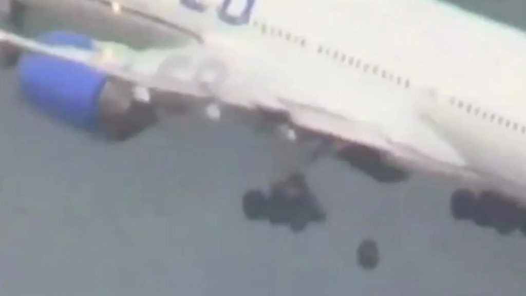 Terrifying moment WHEEL drops off packed Boeing passenger plane during takeoff and falls on runway