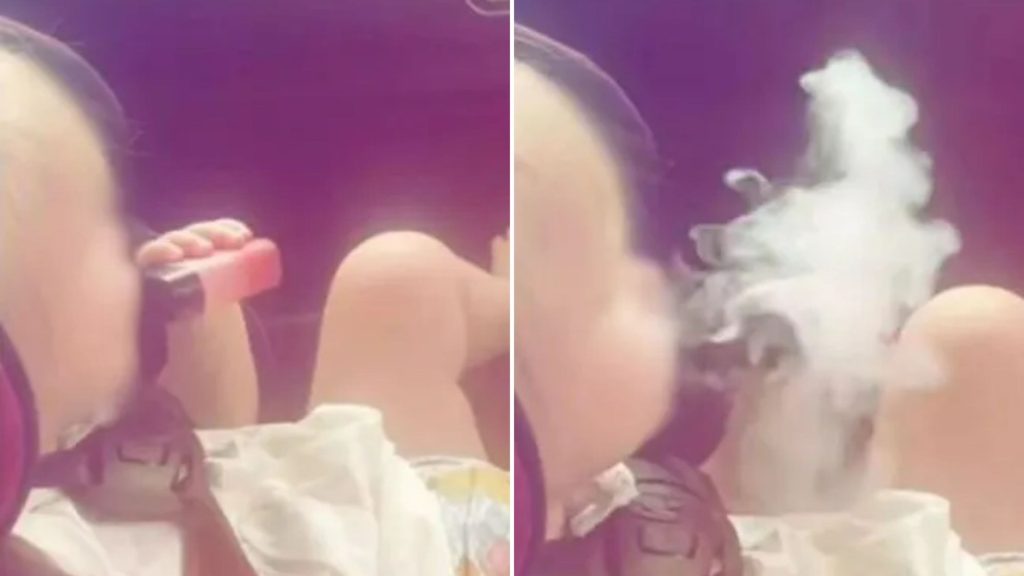 Shocking video emerges showing a baby in a nappy puffing on a vape before coughing fit
