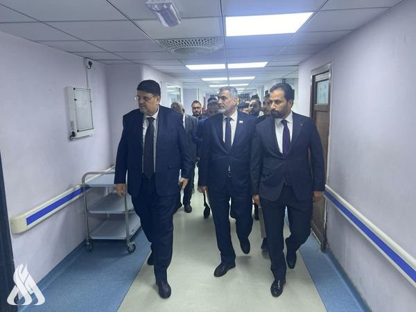 A delegation from the electronic communication team reviews the services provided at Al-Sadr Teaching Hospital