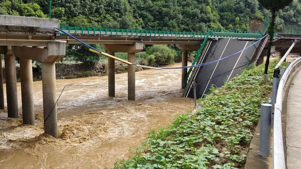 At least 11 people dead and dozens missing after bridge collapse in China following horror floods and heavy storms