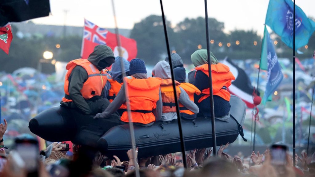 Banksy says Home Secretary James Cleverly’s comments about his Glastonbury migrant boat stunt were ‘a bit over the top’ | Ents & Arts News