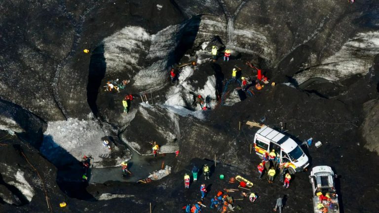 Frantic rescuers dig by hand to save tourists buried in Iceland glacier for 24 hours after deadly ice cave collapse